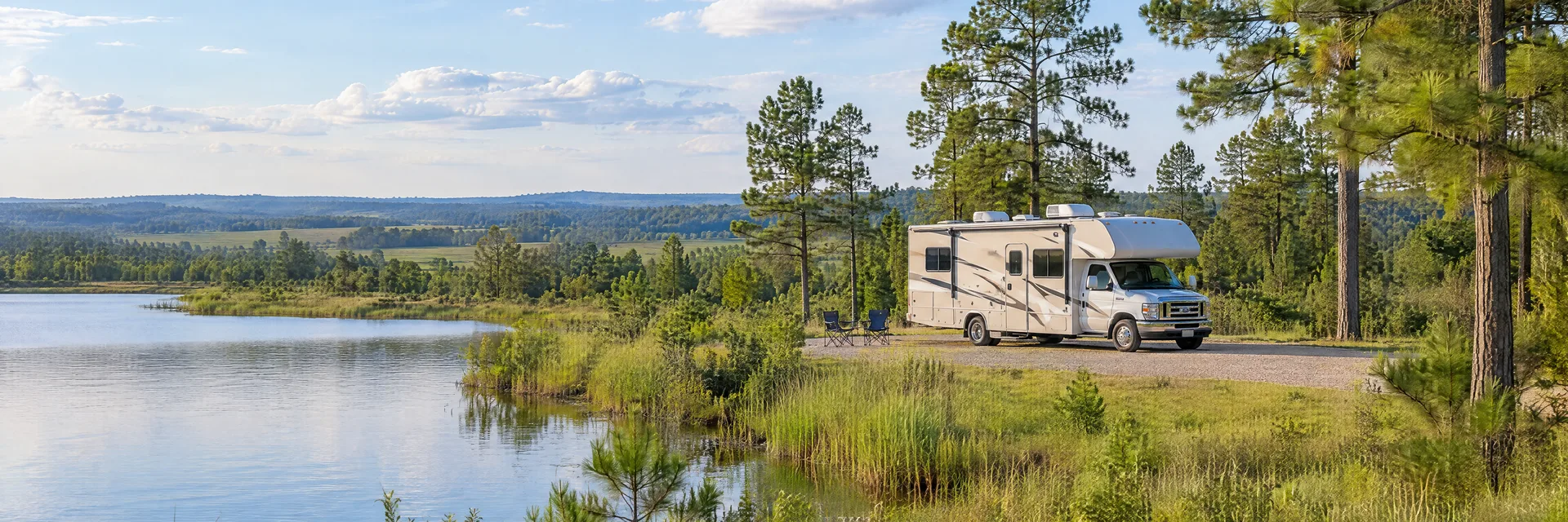 Illustration of a Class C motorhome at a fictional camping setting inspired by Dothan, AL.