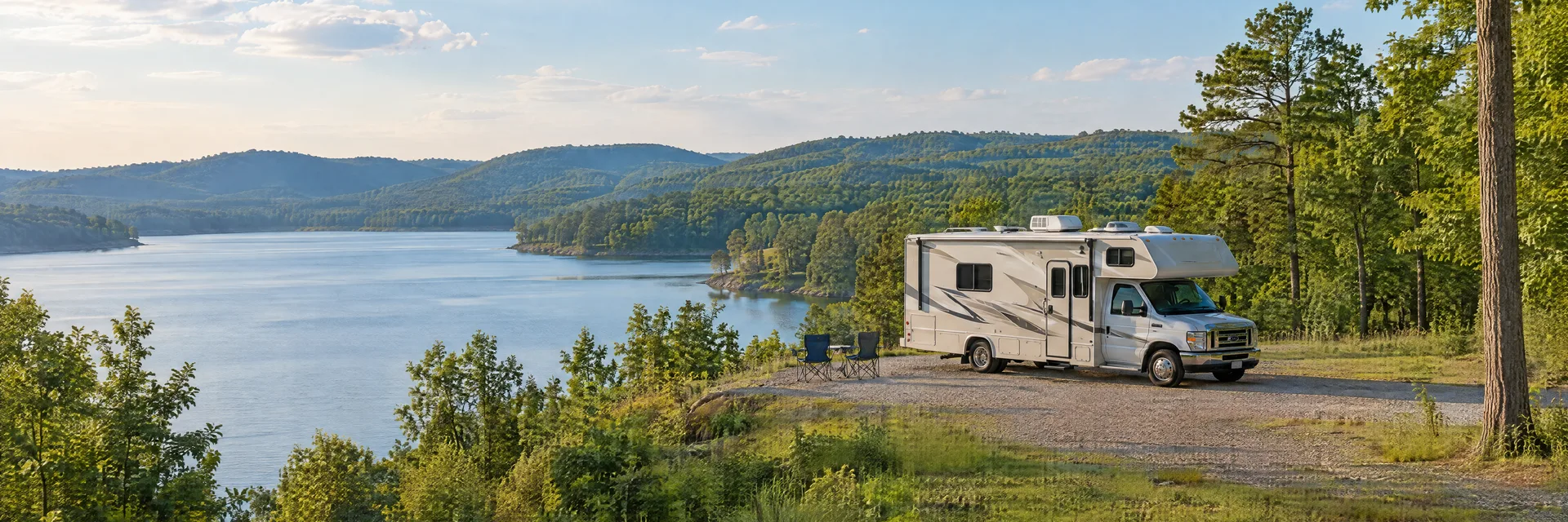 Illustration of a Class C motorhome at a fictional camping setting inspired by Lincoln, AL.