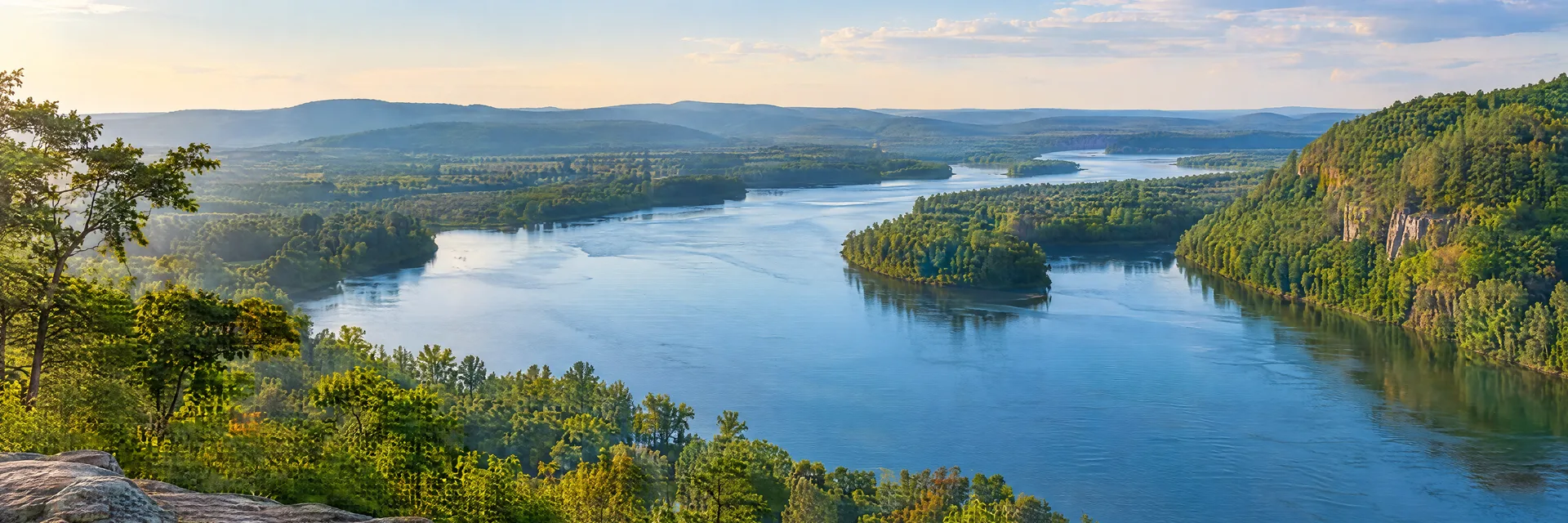 Illustration inspired by Little Rock, AR: central Arkansas river corridor, wooded hills and broad blue water outside the city.