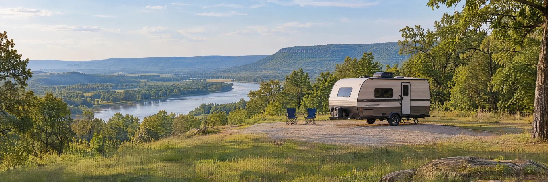 Illustration of a compact travel trailer at a fictional camping setting inspired by Morrilton, AR.