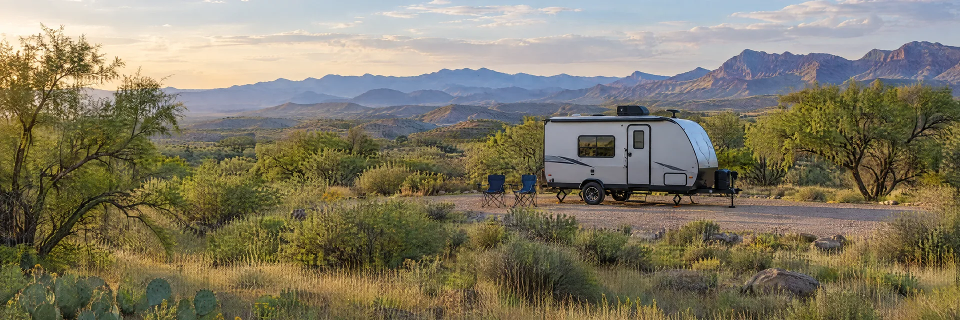 Illustration of a compact travel trailer at a fictional camping setting inspired by Benson, AZ.