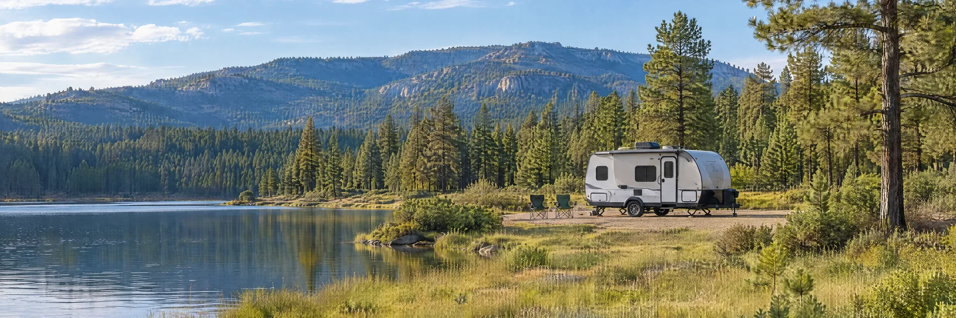 Illustration of a compact travel trailer at a fictional camping setting inspired by Show Low, AZ.