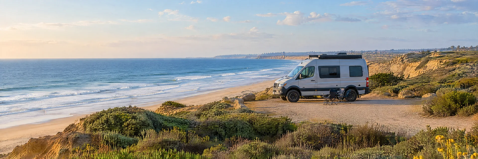 Illustration of a camper van at a fictional camping setting inspired by Cardiff, CA.
