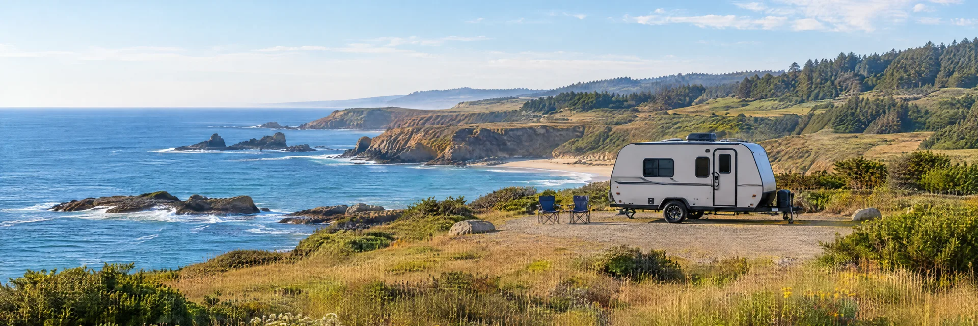 Illustration of a compact travel trailer at a fictional camping setting inspired by Caspar, CA.