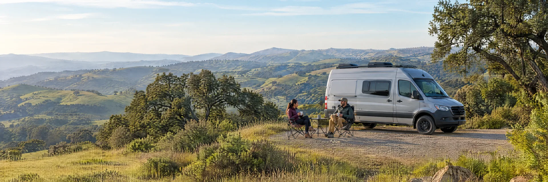 Illustration of campers enjoying morning coffee beside a camper van in a fictional camping setting inspired by Chino Hills, CA.