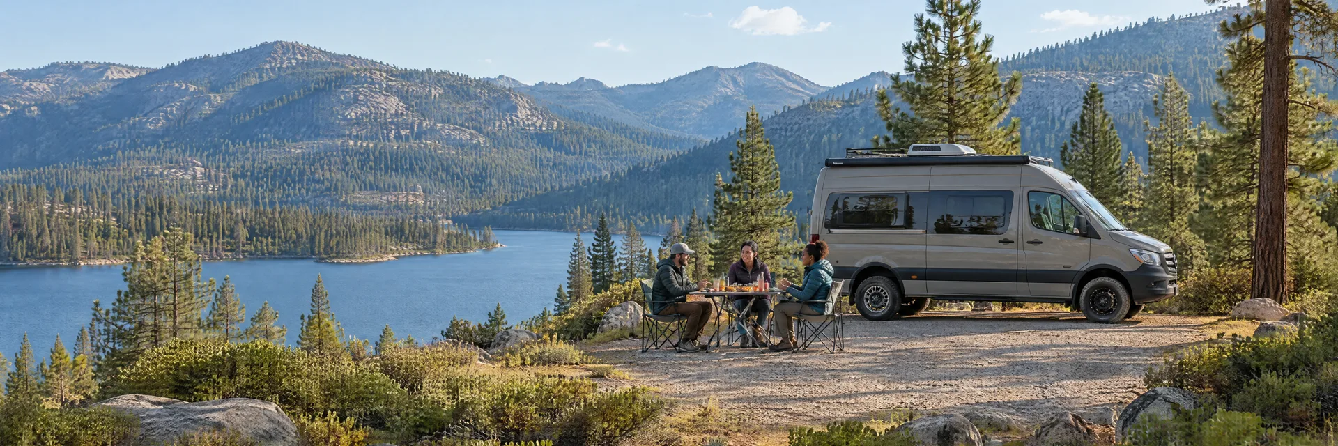 Illustration of campers enjoying an outdoor meal beside a camper van in a fictional camping setting inspired by Green Valley Lake, CA.