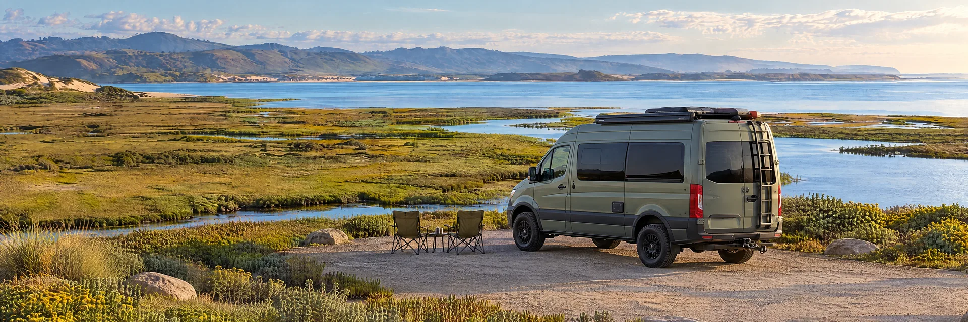 Illustration of a sage-green modern campervan at a fictional camping setting inspired by Morro Bay, CA.
