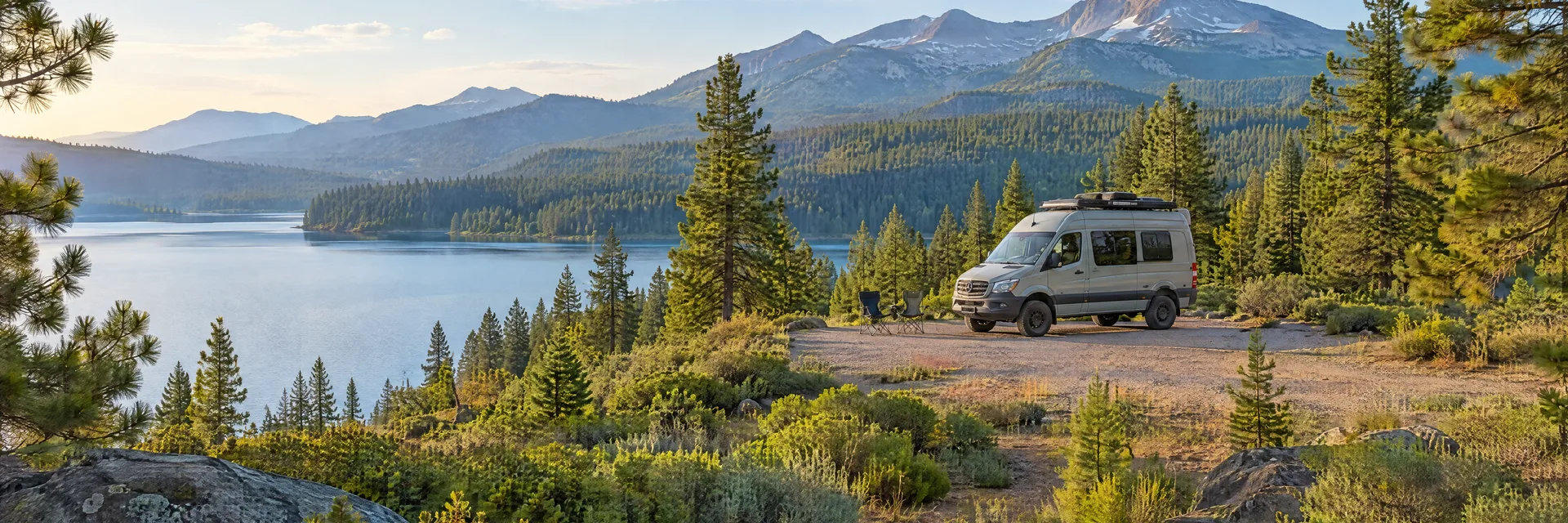 Illustration of a camper van at a fictional camping setting inspired by Mt Shasta, CA.