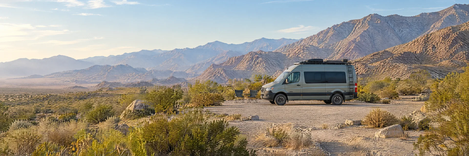 Illustration of a camper van at a fictional camping setting inspired by Palm Springs, CA.