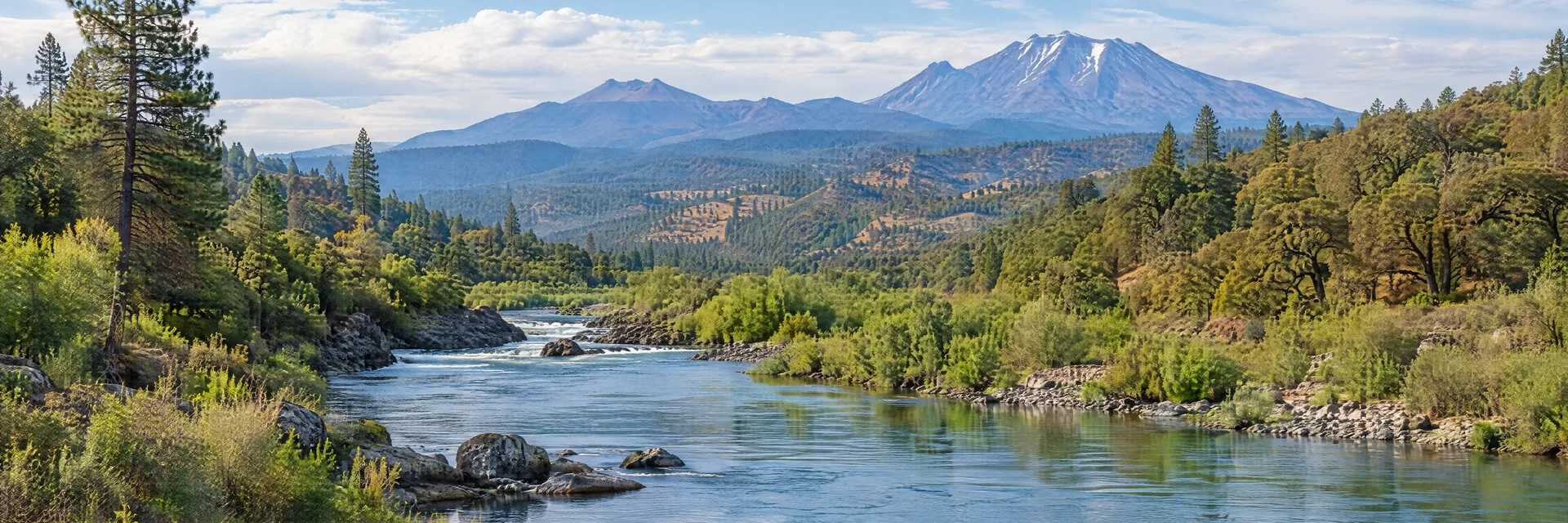 Illustration inspired by Redding, CA: northern California river with pine-oak foothills and distant volcanic terrain.