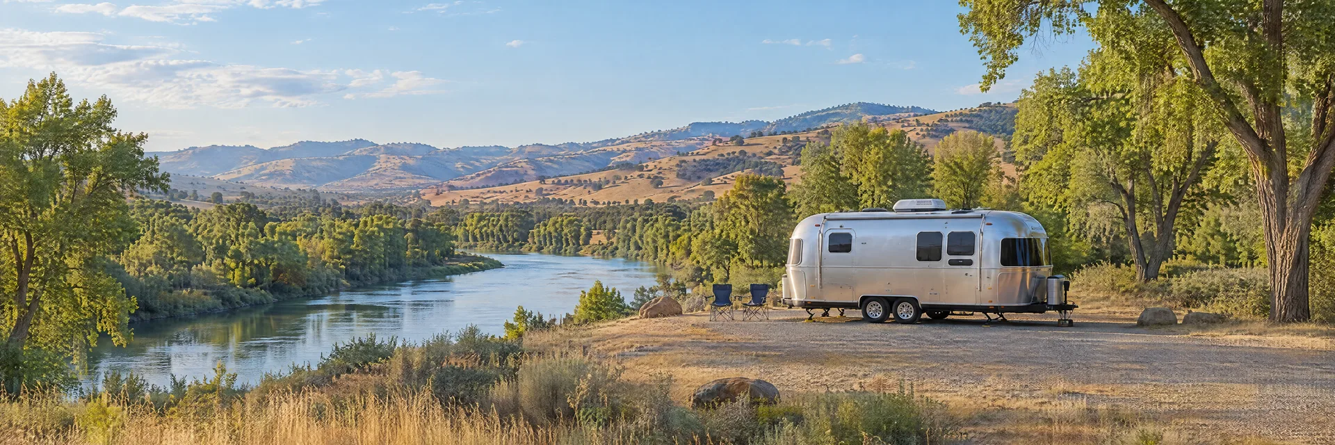 Illustration of a rounded silver travel trailer at a fictional camping setting inspired by Sacramento, CA.