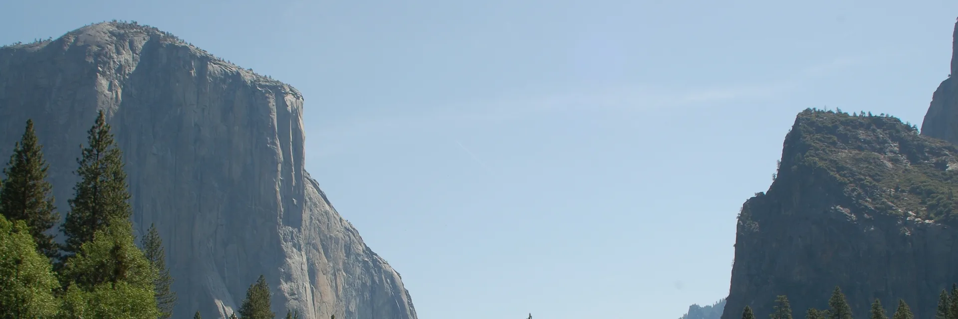 Granite cliffs and pine forest in Yosemite Valley.