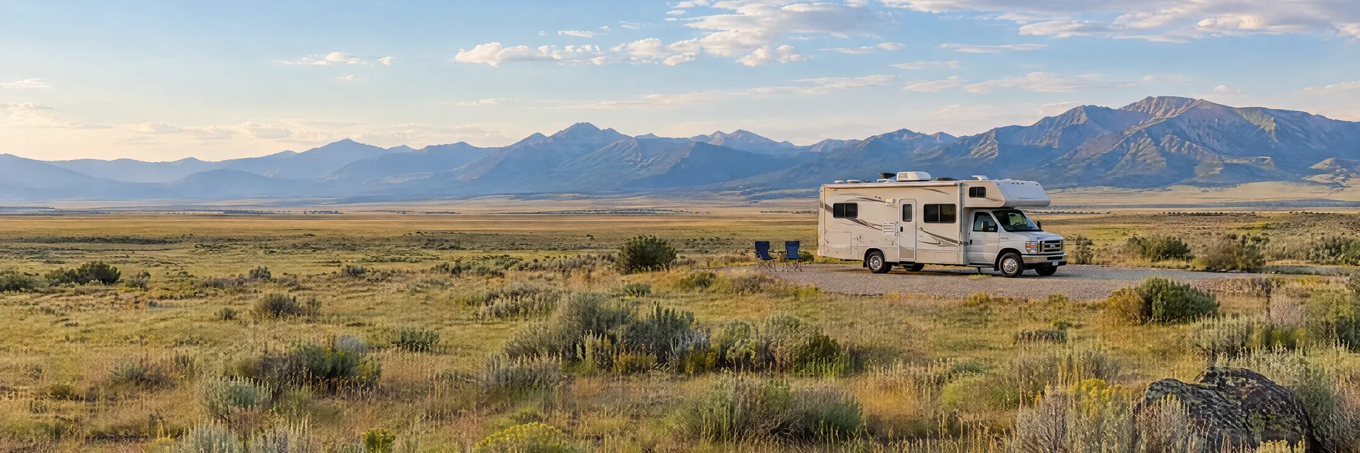 Illustration of a Class C motorhome at a fictional camping setting inspired by Capulin, CO.