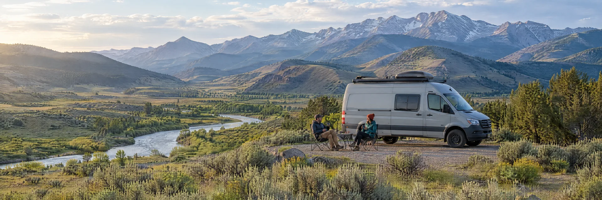 Illustration of campers enjoying morning coffee beside a camper van in a fictional camping setting inspired by Gunnison, CO.