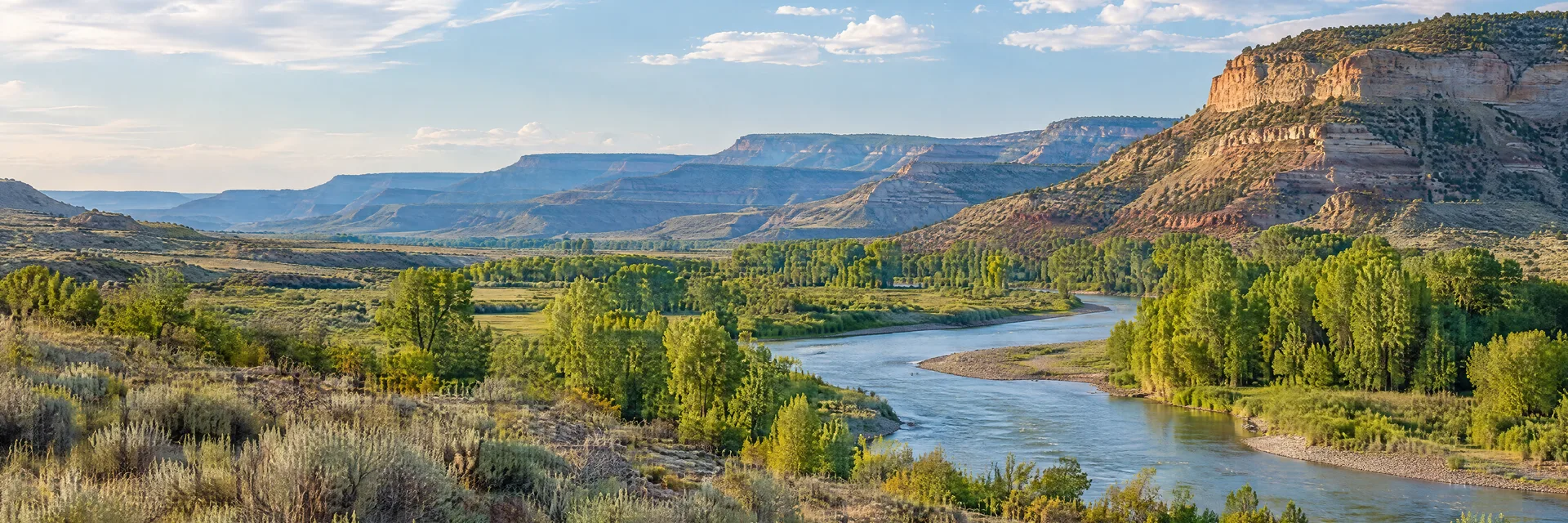 Illustration inspired by Meeker, CO: northwestern Colorado river valley, sagebrush, cottonwoods and layered plateau slopes.