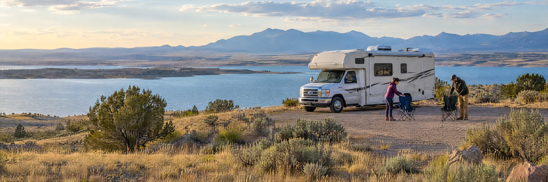Illustration of campers enjoying setting up camp beside a Class C motorhome in a fictional camping setting inspired by Pueblo West, CO.