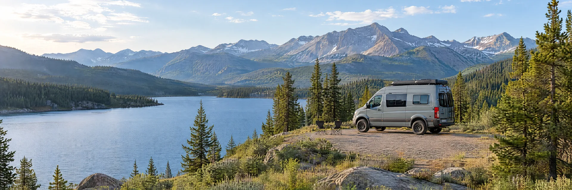 Illustration of a camper van at a fictional camping setting inspired by Twin Lakes, CO.