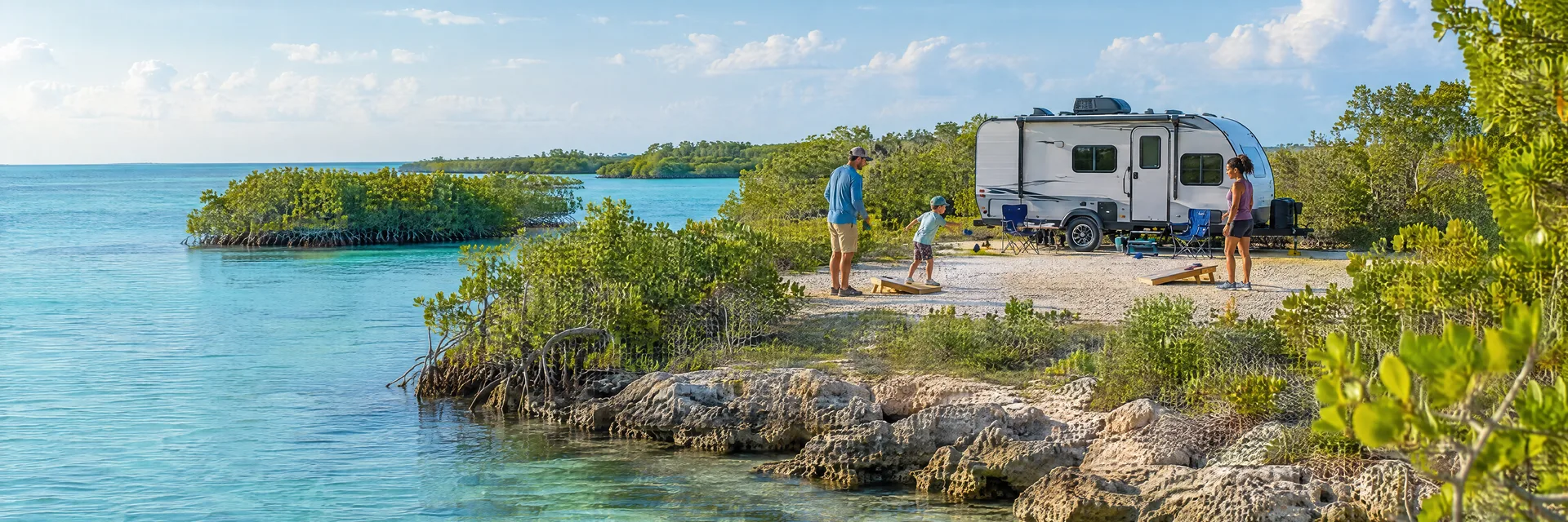 Illustration of campers enjoying family campsite activities beside a compact travel trailer in a fictional camping setting inspired by Islamorada, FL.