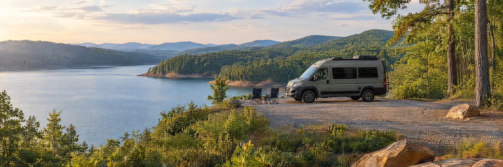 Illustration of a camper van at a fictional camping setting inspired by Cartersville, GA.