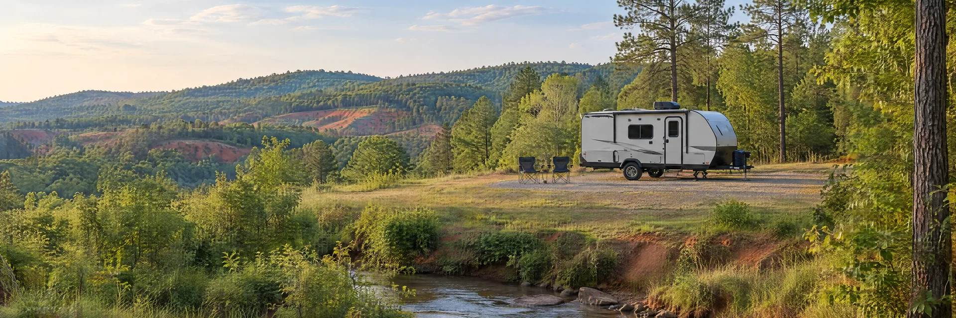 Illustration of a compact travel trailer at a fictional camping setting inspired by Lumpkin, GA.