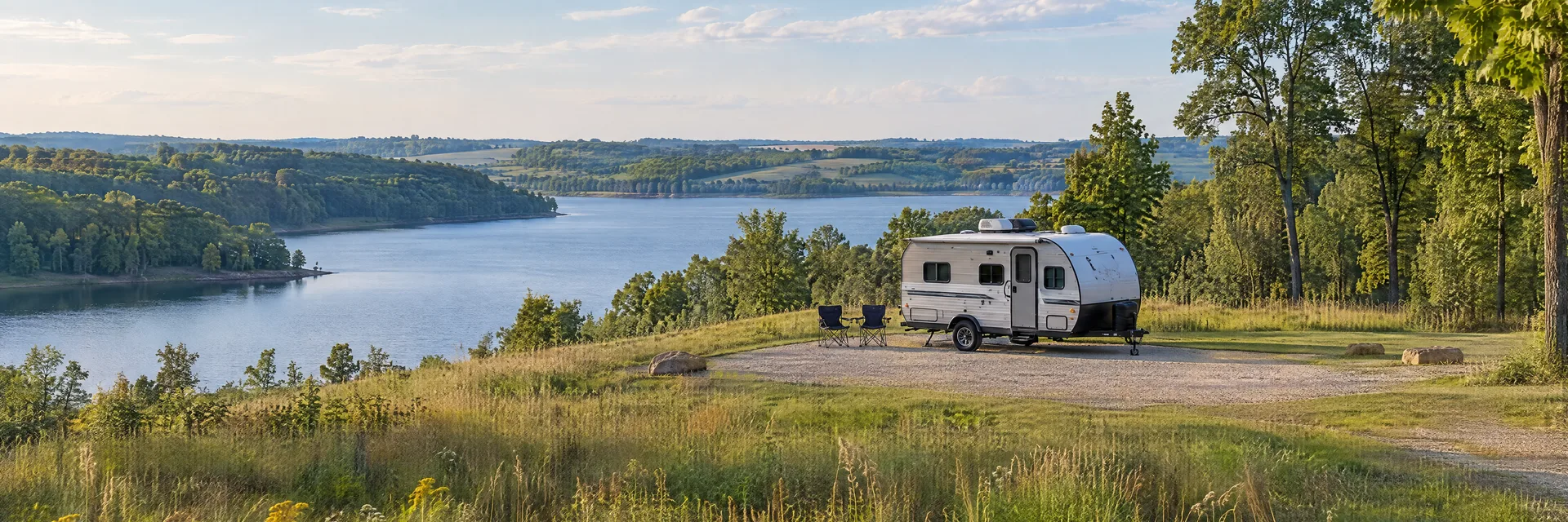 Illustration of a compact travel trailer at a fictional camping setting inspired by Iowa City, IA.