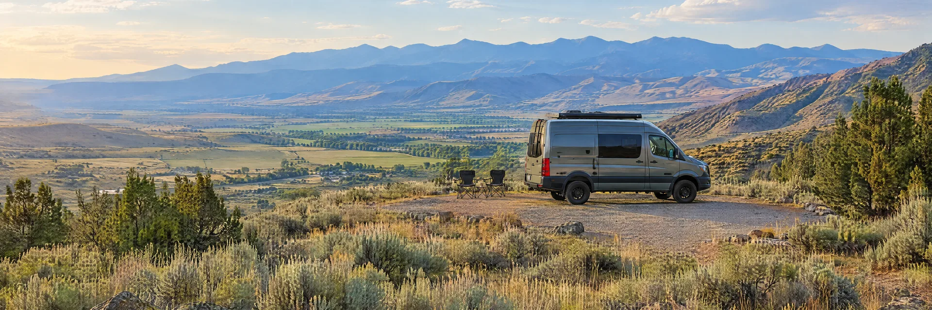 Illustration of a camper van at a fictional camping setting inspired by Pocatello, ID.