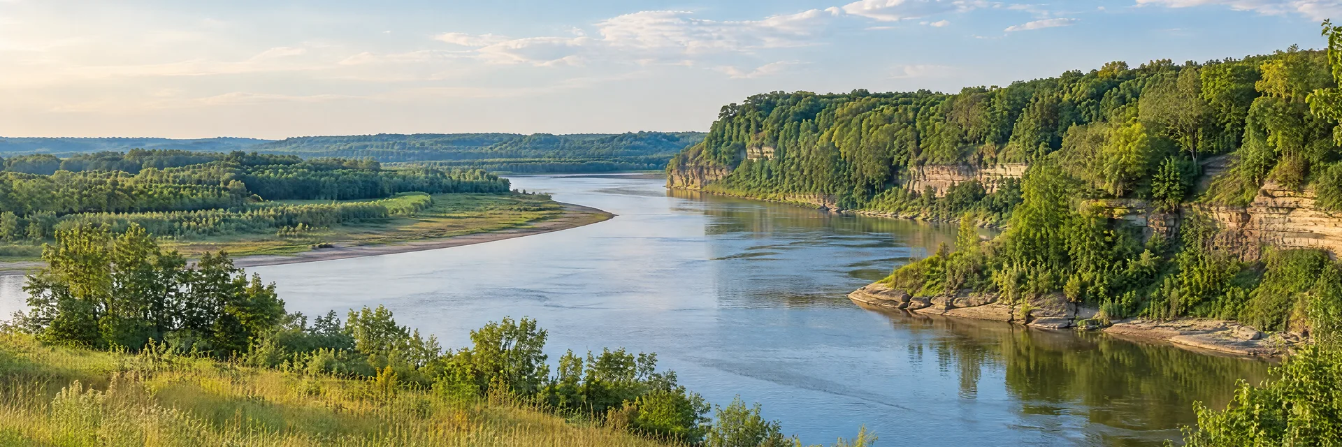 Illustration inspired by Ottawa, IL: northern Illinois broad river bend with leafy hardwood bluffs, green meadow and low sandstone banks.