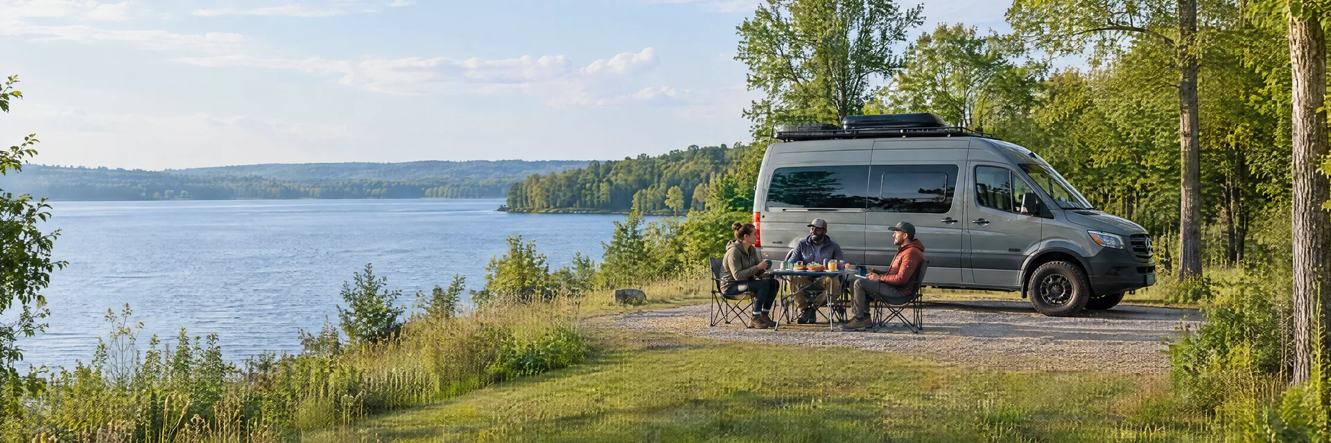 Illustration of campers enjoying an outdoor meal beside a camper van in a fictional camping setting inspired by ANGOLA, IN.