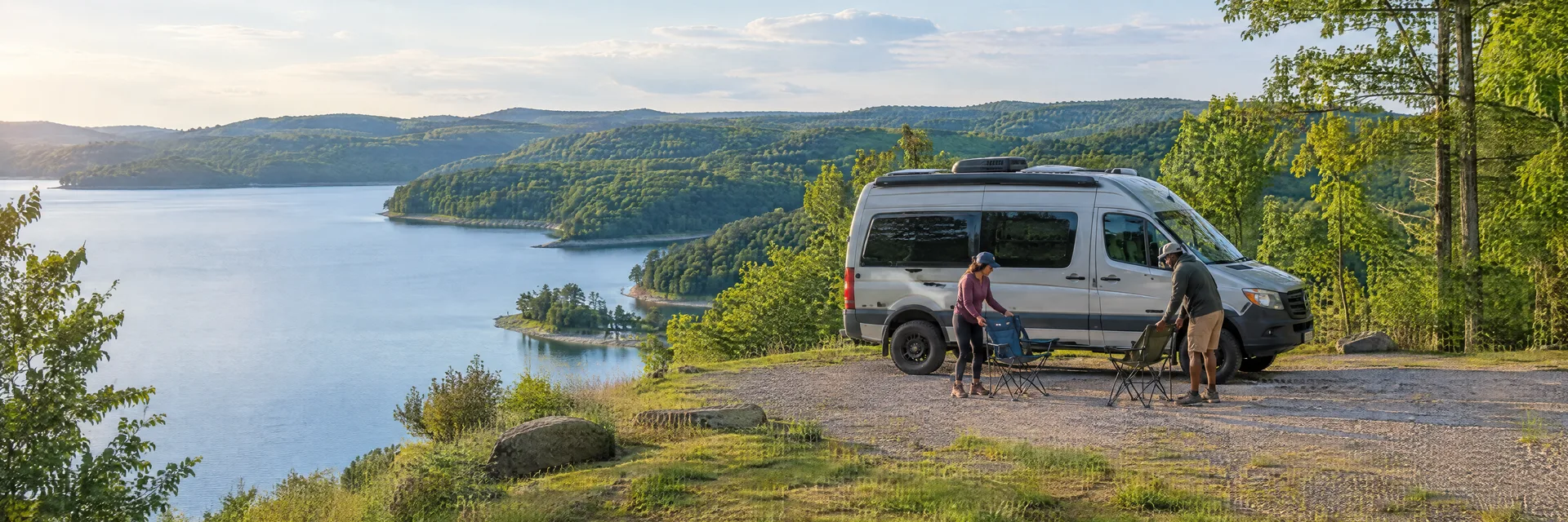 Illustration of campers enjoying setting up camp beside a camper van in a fictional camping setting inspired by Cadiz, KY.