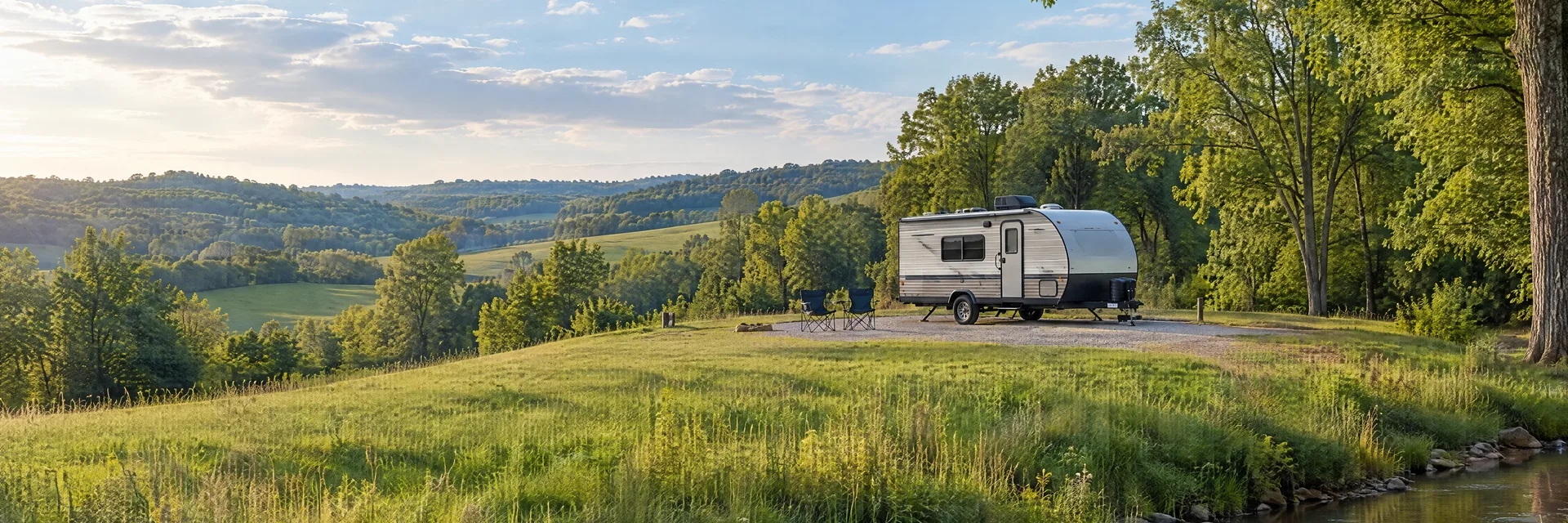 Illustration of a compact travel trailer at a fictional camping setting inspired by Dry Ridge, KY.
