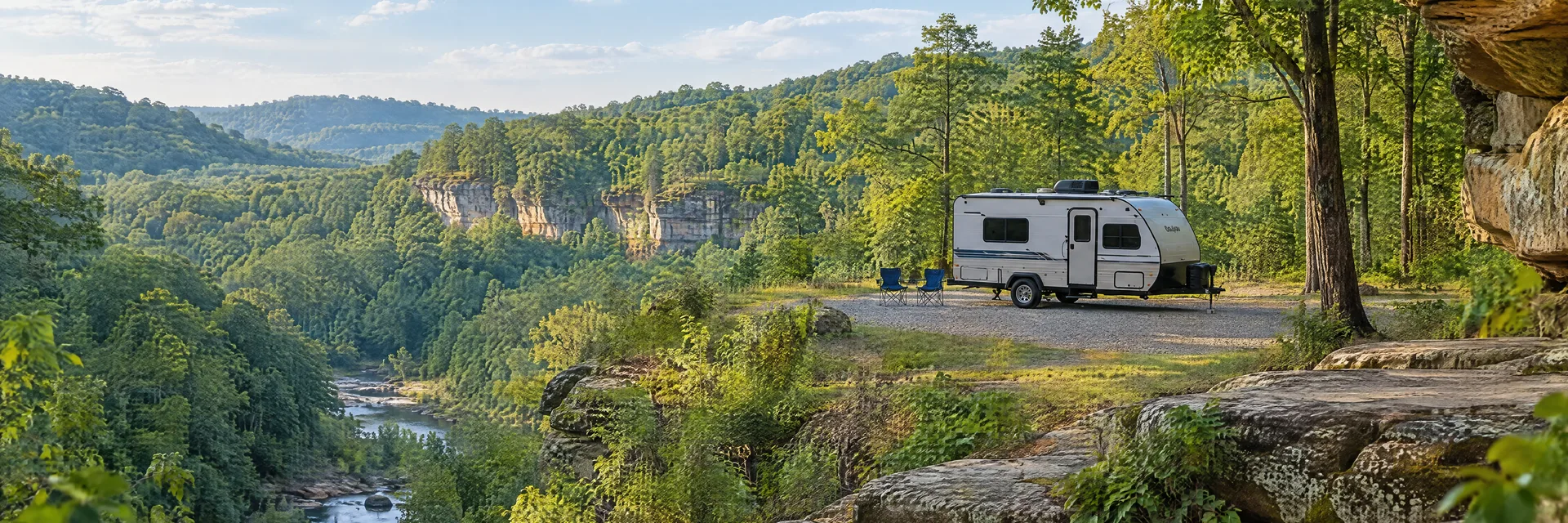 Illustration of a compact travel trailer at a fictional camping setting inspired by London, KY.