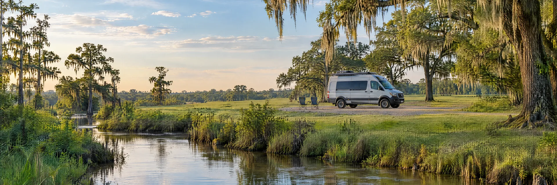 Illustration of a camper van at a fictional camping setting inspired by Robert, LA.