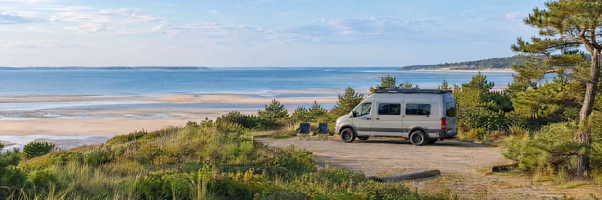 Illustration of a camper van at a fictional camping setting inspired by Brewster, MA.