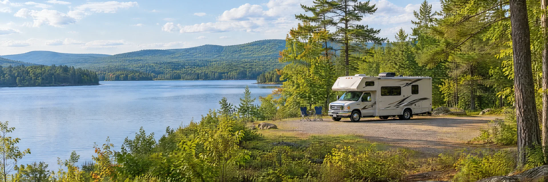 Illustration of a Class C motorhome at a fictional camping setting inspired by Southwick, MA.
