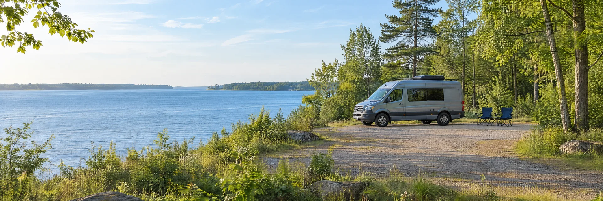Illustration of a camper van at a fictional camping setting inspired by Port Huron, MI.