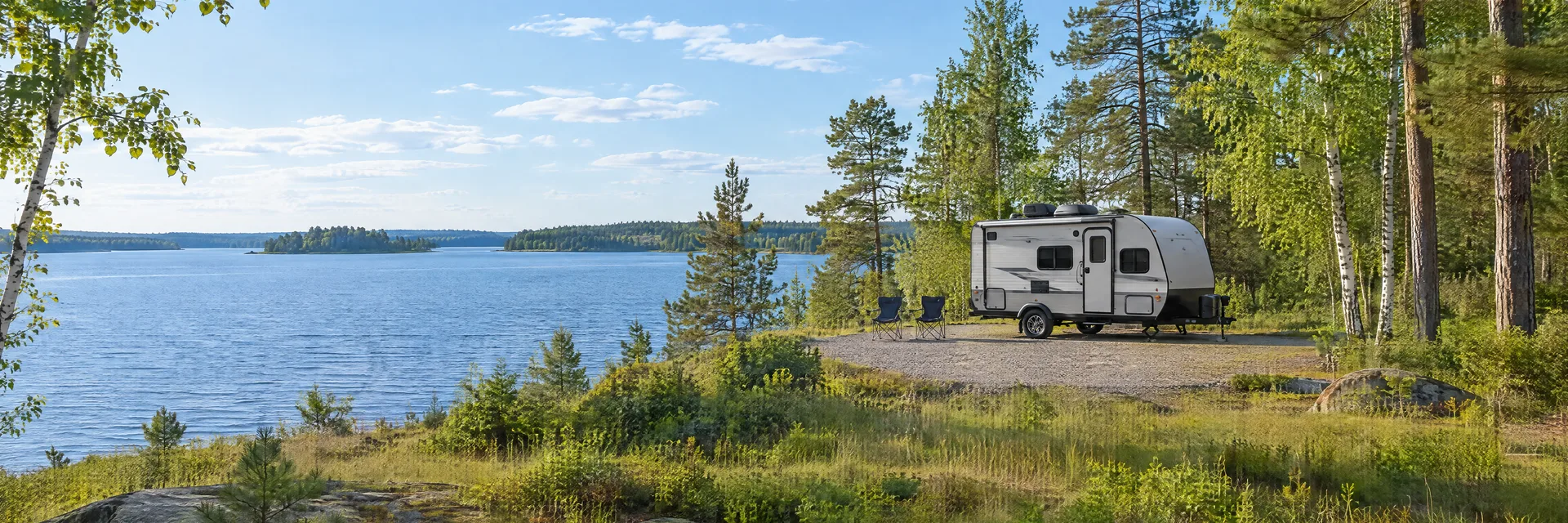Illustration of a compact travel trailer at a fictional camping setting inspired by Crosby, MN.