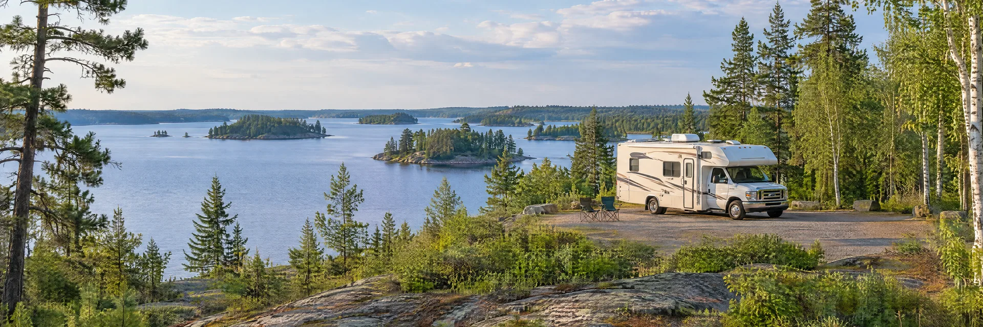 Illustration of a Class C motorhome at a fictional camping setting inspired by Ely, MN.