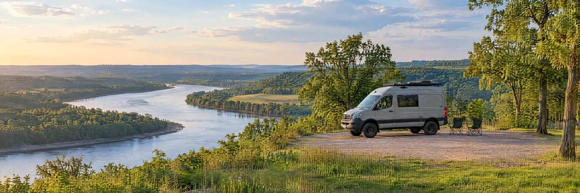Illustration of a camper van at a fictional camping setting inspired by Kansas City, MO.
