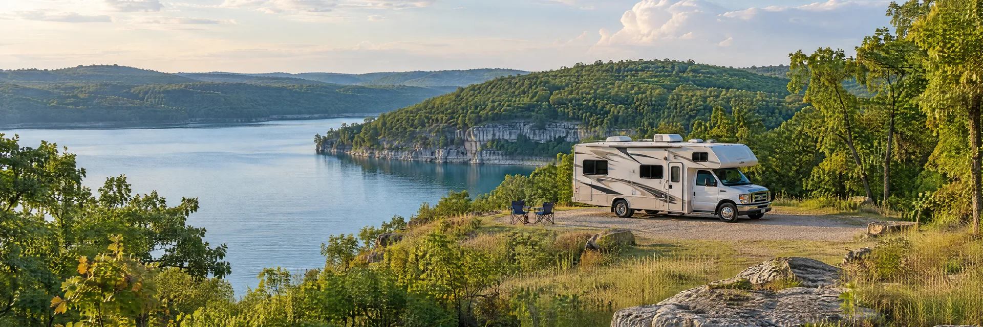 Illustration of a Class C motorhome at a fictional camping setting inspired by Macks Creek, MO.