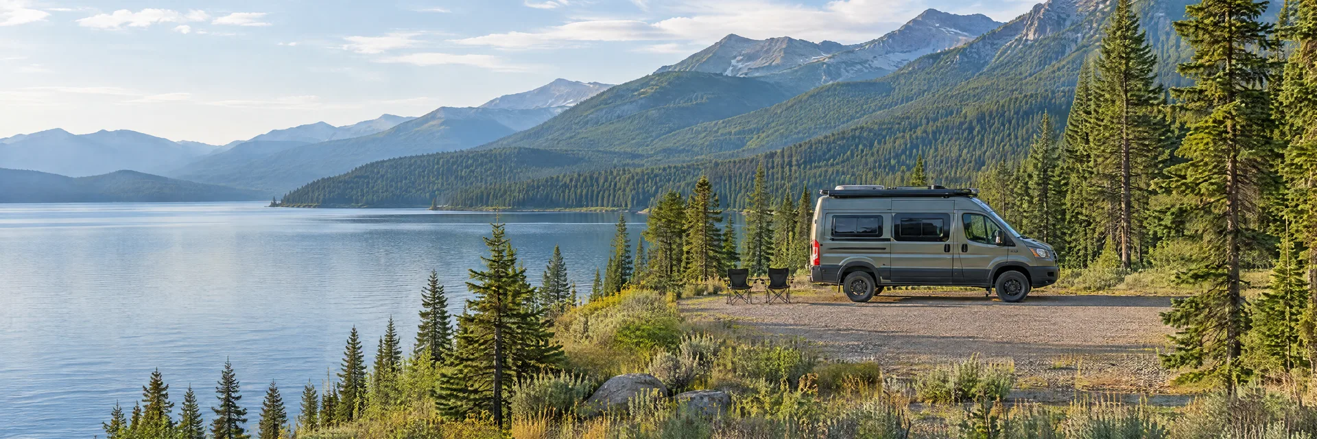 Illustration of a camper van at a fictional camping setting inspired by Bigfork, MT.