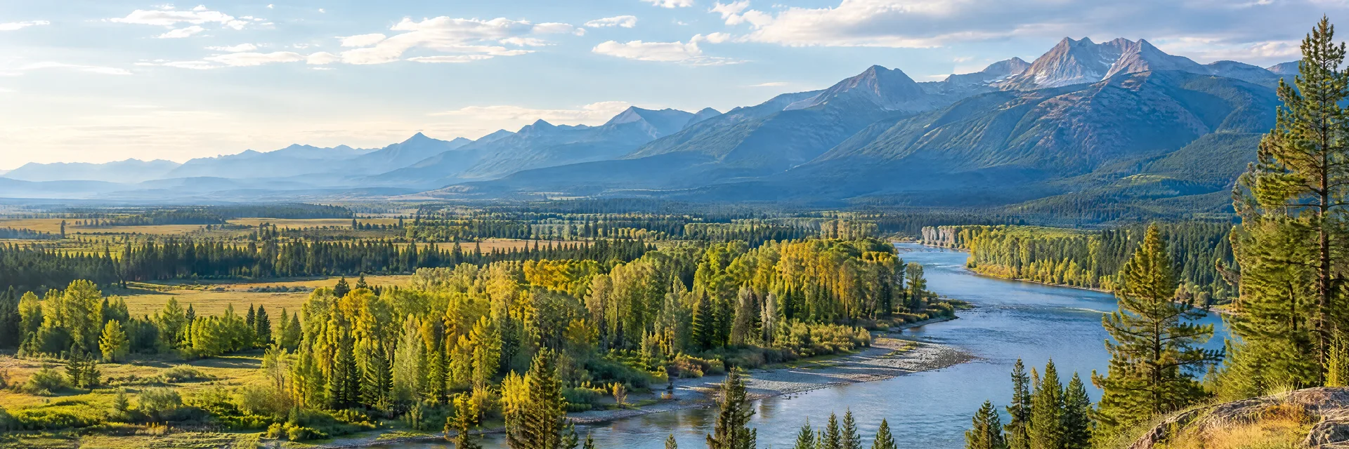 Illustration inspired by Kalispell, MT: northwestern Montana broad mountain valley, pine woods, cottonwood-lined river and distant ridges.