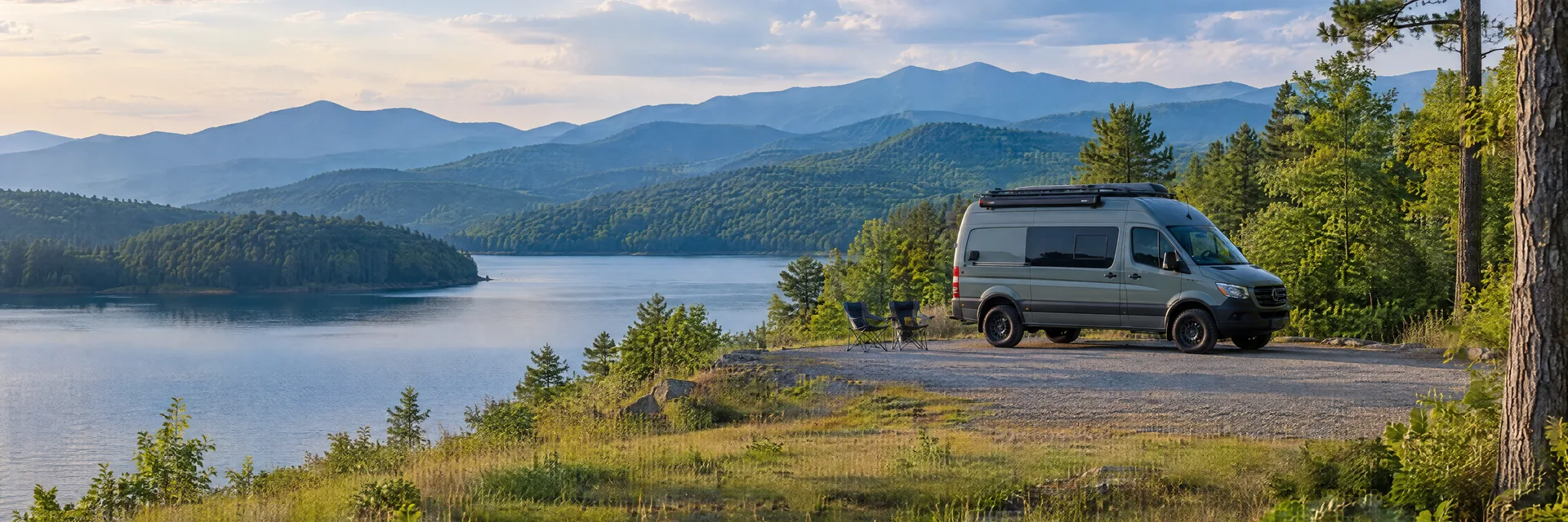 Illustration of a camper van at a fictional camping setting inspired by Hayesville, NC.
