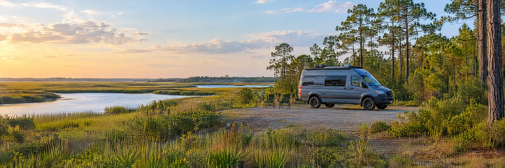 Illustration of a camper van at a fictional camping setting inspired by Holly Ridge, NC.