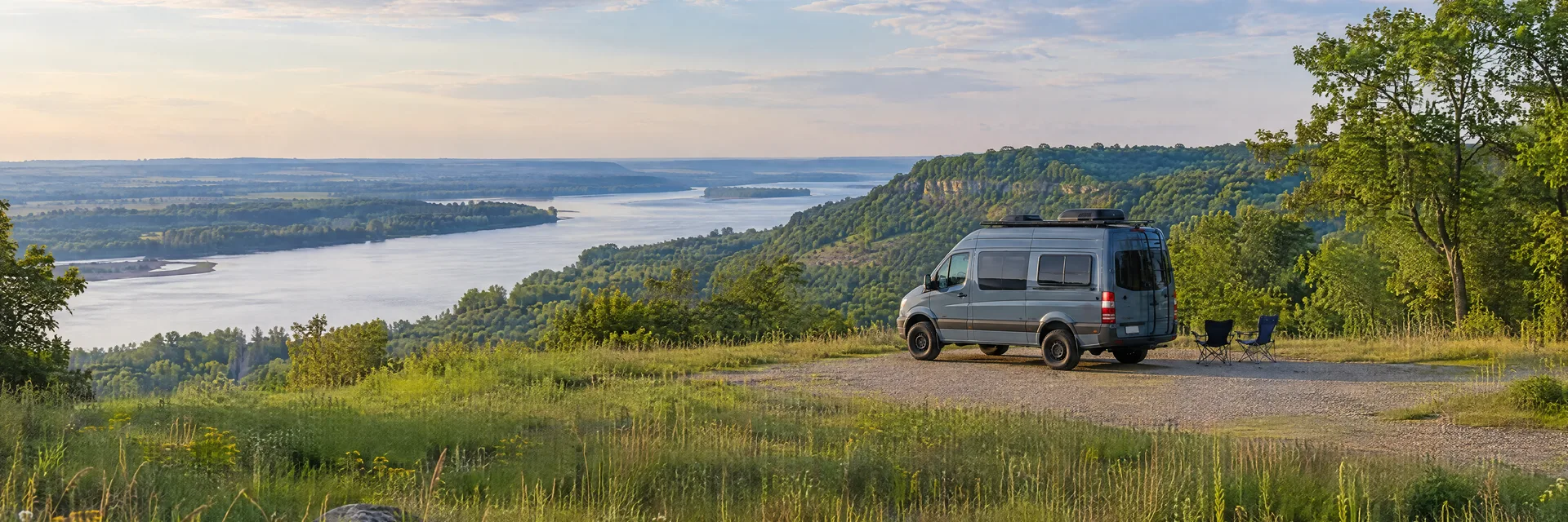 Illustration of a camper van at a fictional camping setting inspired by Nebraska City, NE.