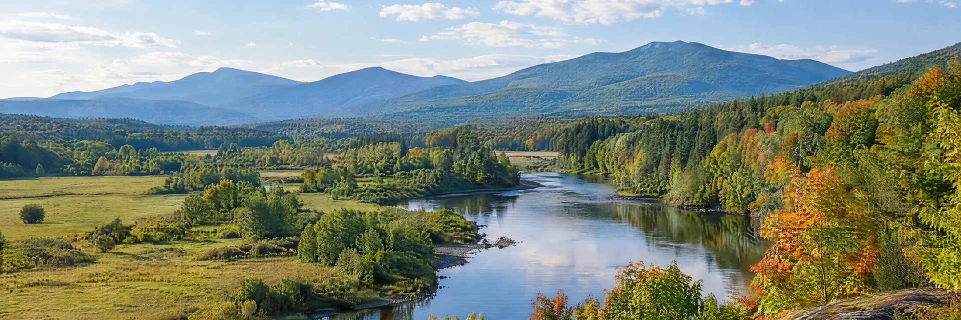 Illustration inspired by Lancaster, NH: northern New Hampshire pastoral river valley with maple groves and distant forested mountain ridges.