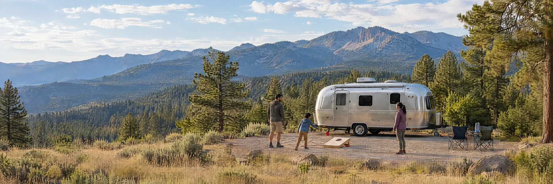 Illustration of campers enjoying family campsite activities beside a rounded silver travel trailer in a fictional camping setting inspired by Alto, NM.