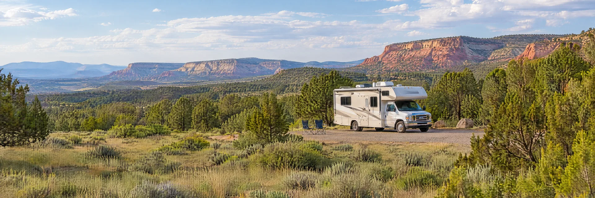 Illustration of a Class C motorhome at a fictional camping setting inspired by Coyote, NM.