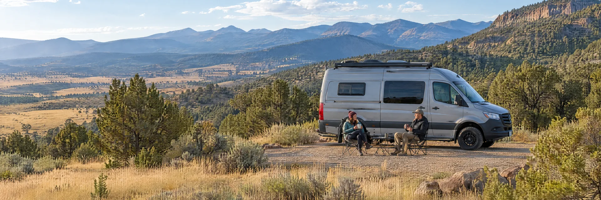 Illustration of campers enjoying morning coffee beside a camper van in a fictional camping setting inspired by Raton, NM.