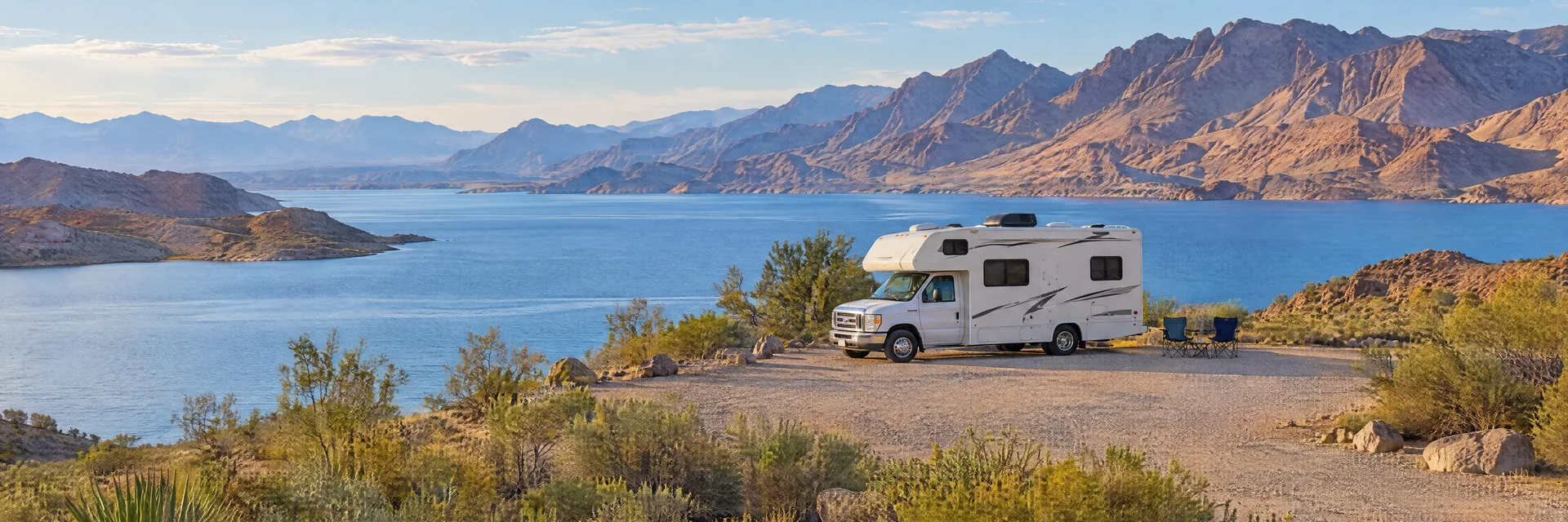 Illustration of a Class C motorhome at a fictional camping setting inspired by Boulder City, NV.