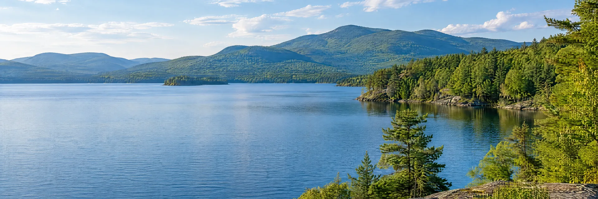 Illustration inspired by Diamond Point, NY: new York southern Adirondack lake country, blue freshwater lake, pine and hardwood shoreline and rounded forested mountains.